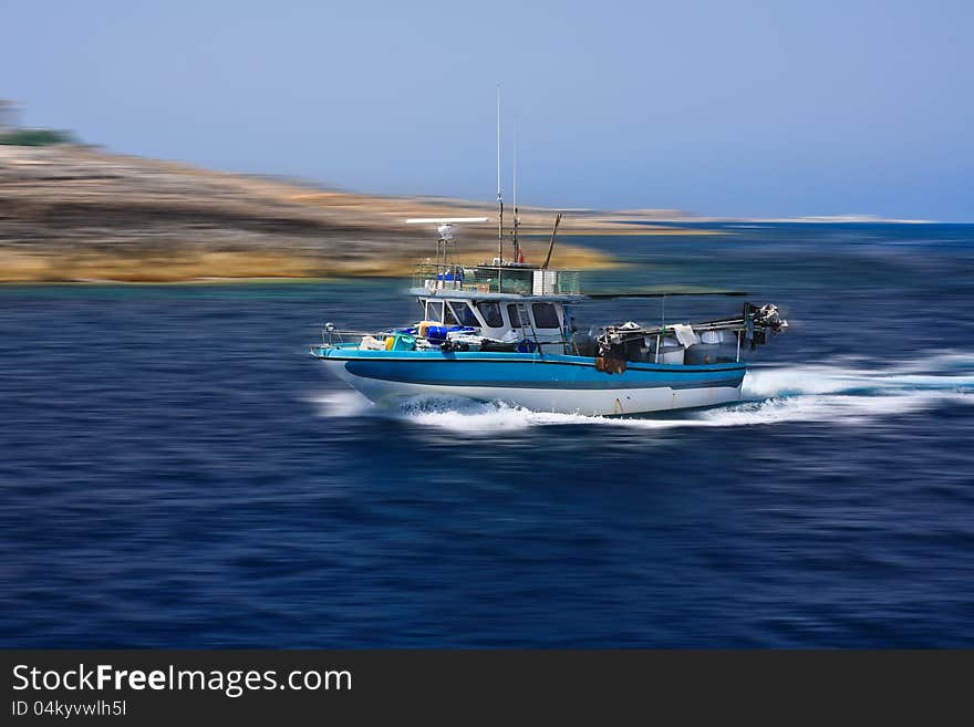 Fishing boat on way back to harbour. Fishing boat on way back to harbour