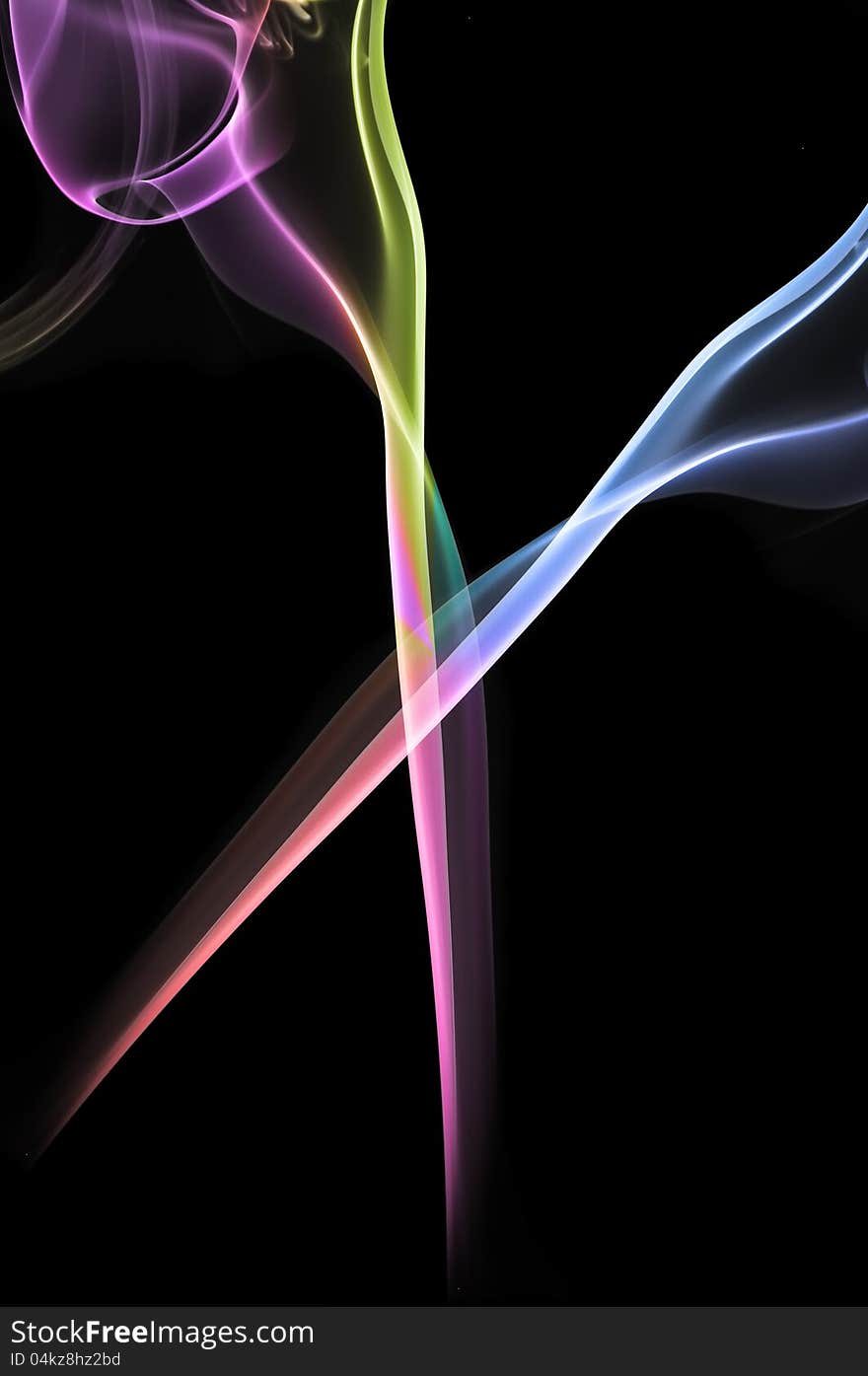 Streams of multicolored smoke on a black background. Streams of multicolored smoke on a black background