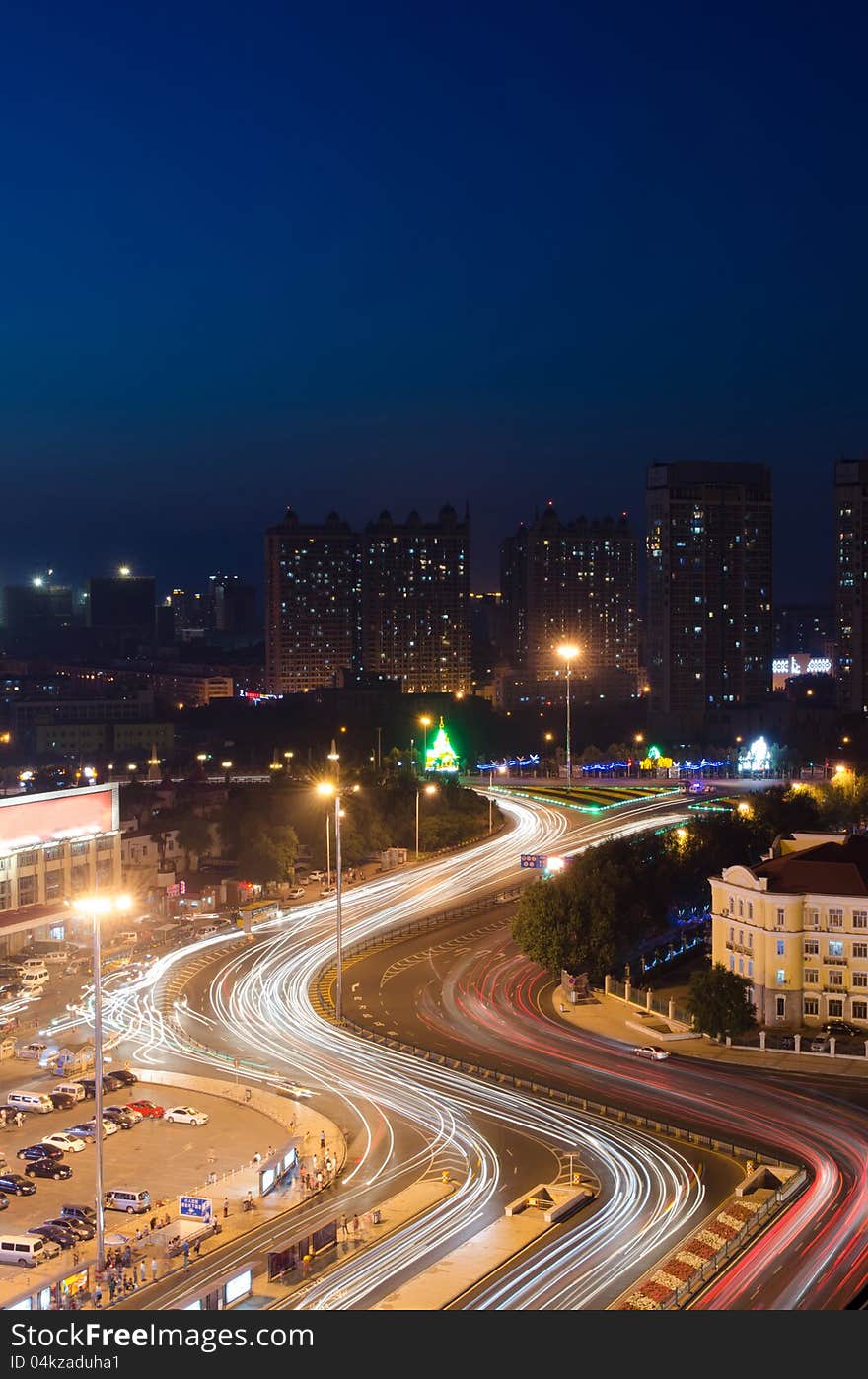 This image was taken from the top of an apartment and show Harbin, China illuminated at night. This image was taken from the top of an apartment and show Harbin, China illuminated at night.