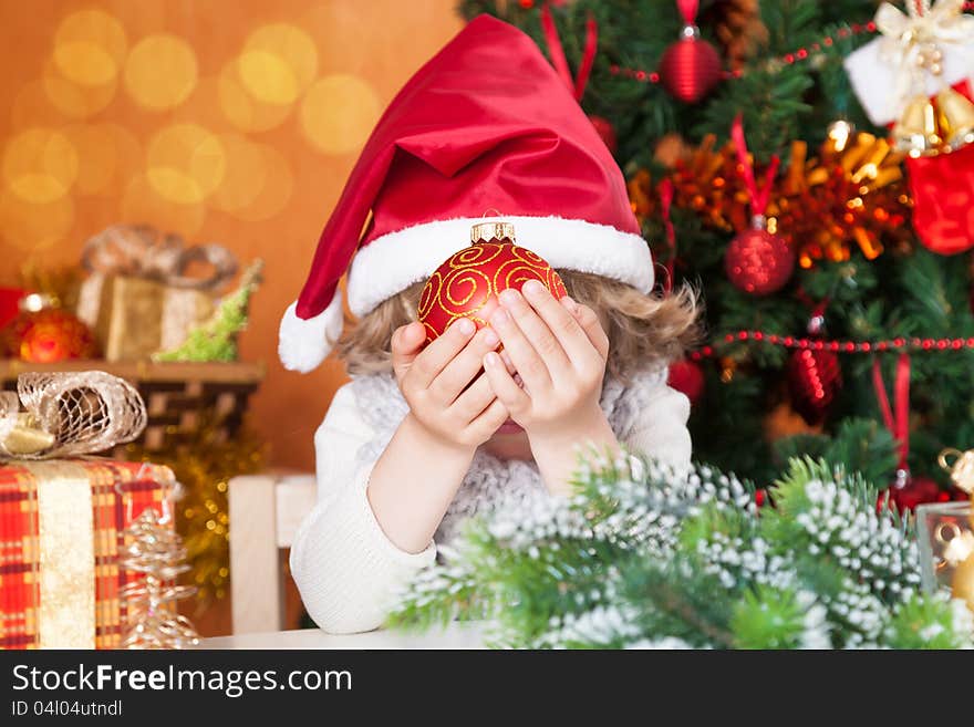 Happy Child Holding Christmas Ball