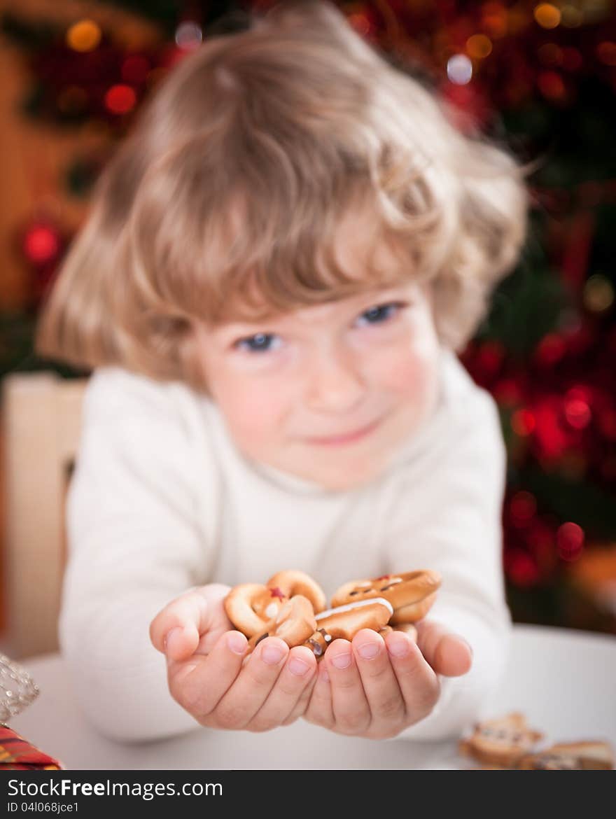 Happy child holding cookies