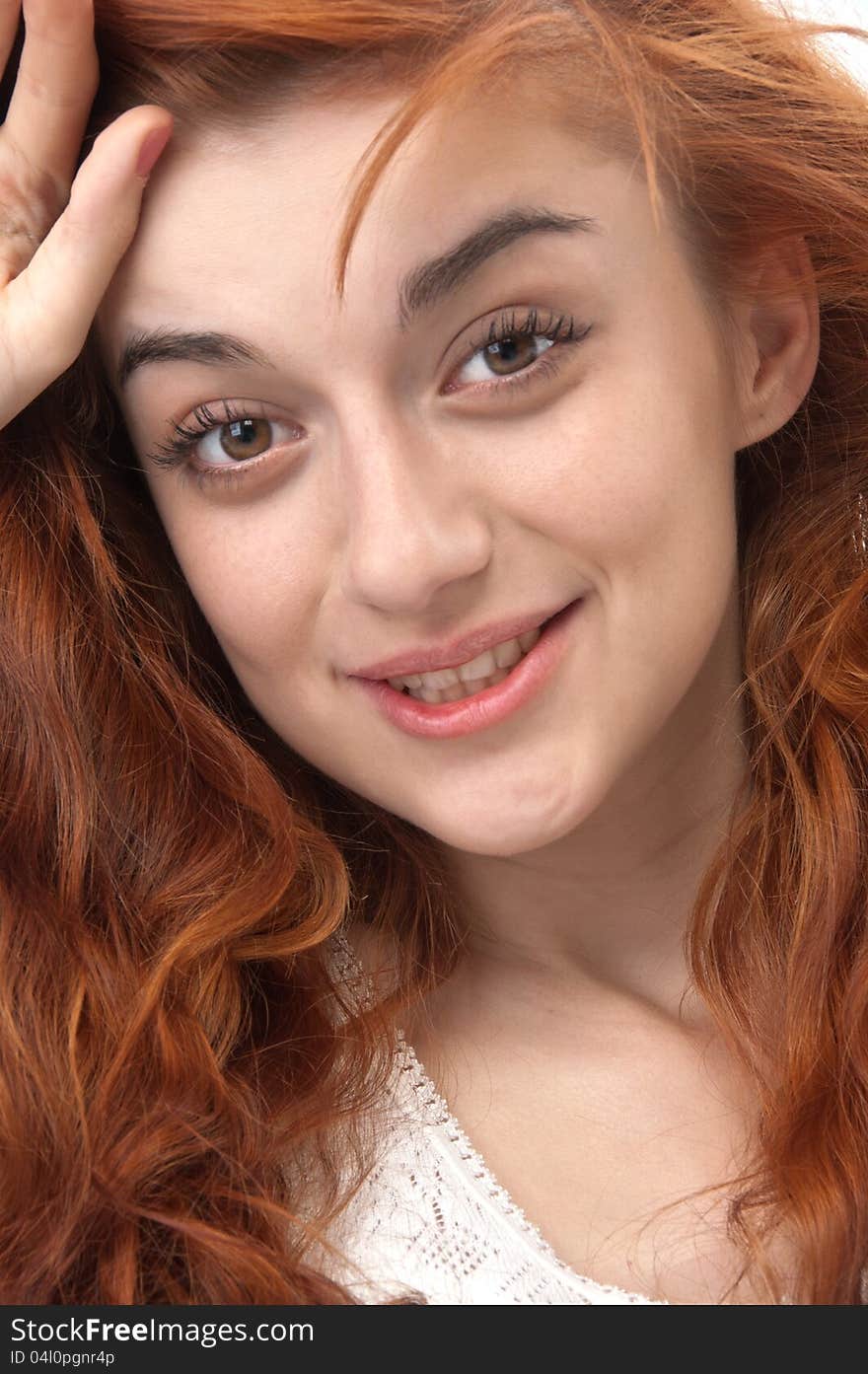 Portrait of a smiling red haired girl