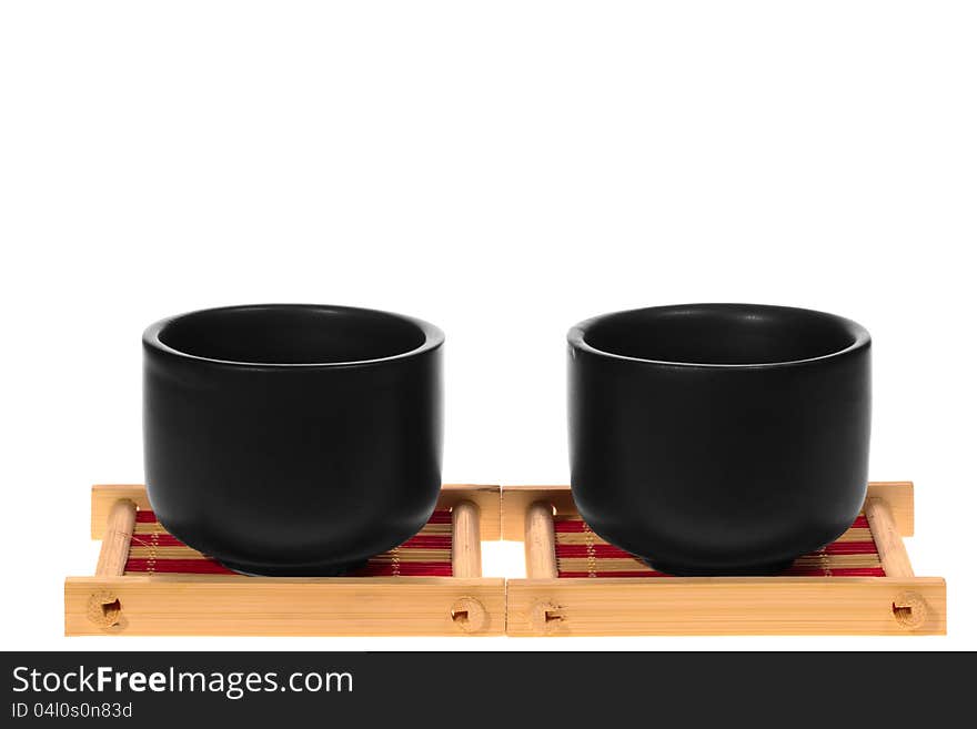 Black cups on a stand isolated on white