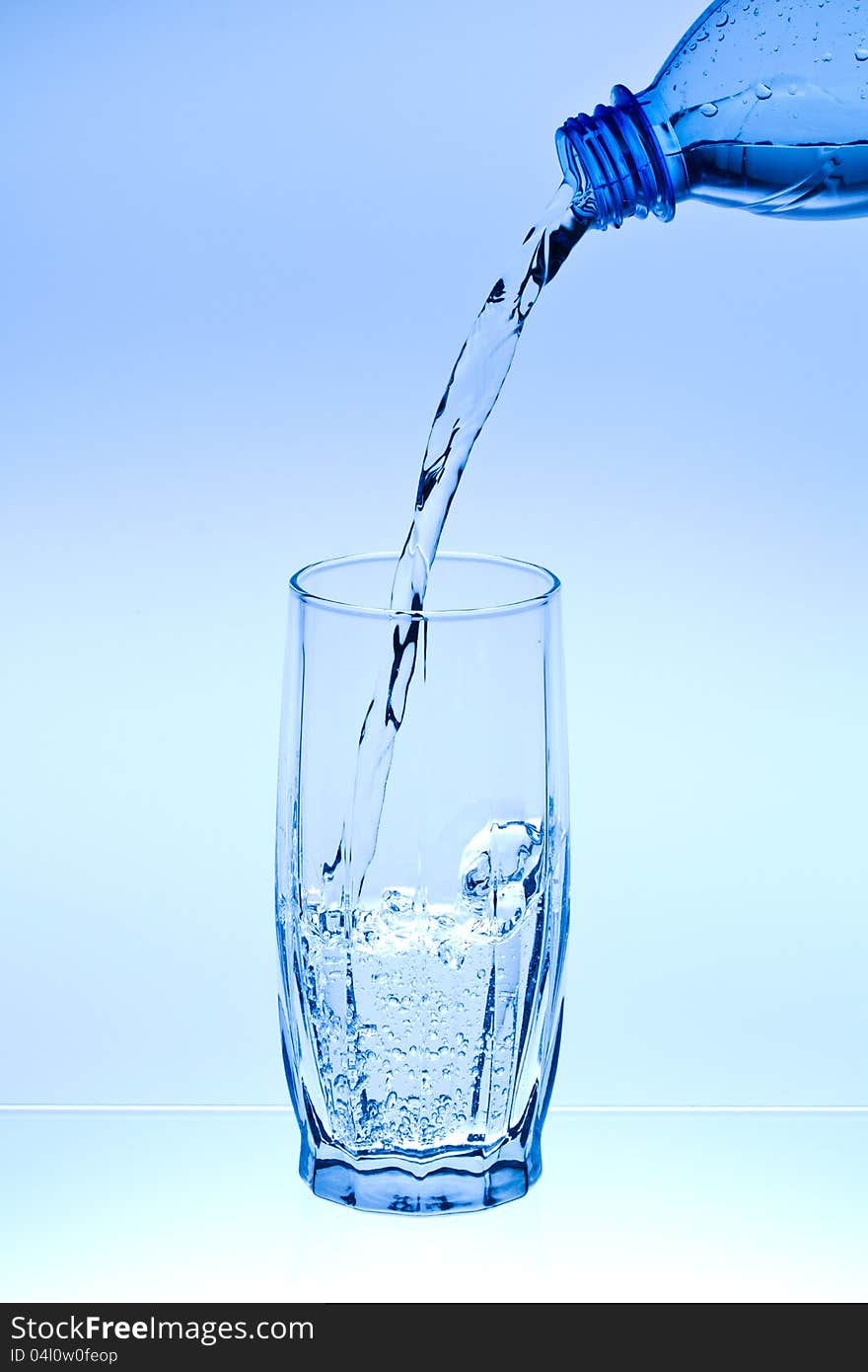 Water flow in a glass from a bottle