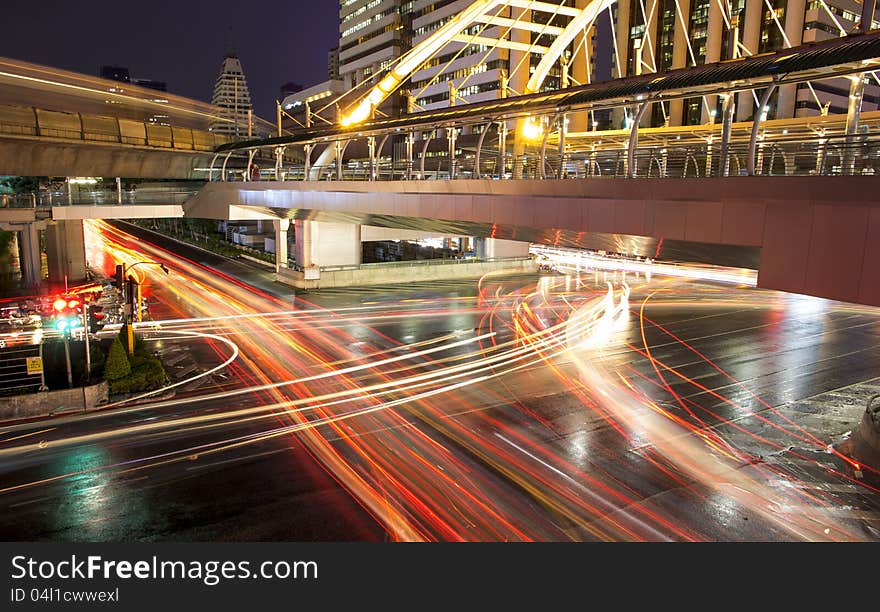 Lights on at night In the city the car is running. Lights on at night In the city the car is running