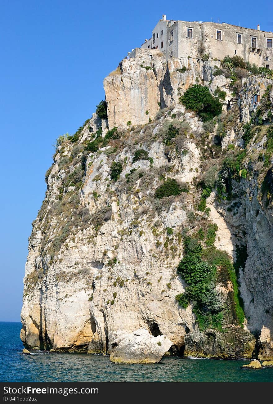 A landscape of the coast of the Gargano, a group of houses overlooking the sea - Peschici (FG). A landscape of the coast of the Gargano, a group of houses overlooking the sea - Peschici (FG)