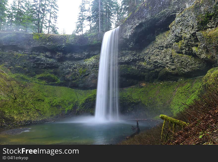 Waterfall cascading over mossy rocks