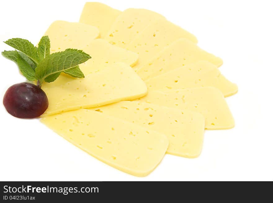 Cheese on a white background decorated with radish and mint