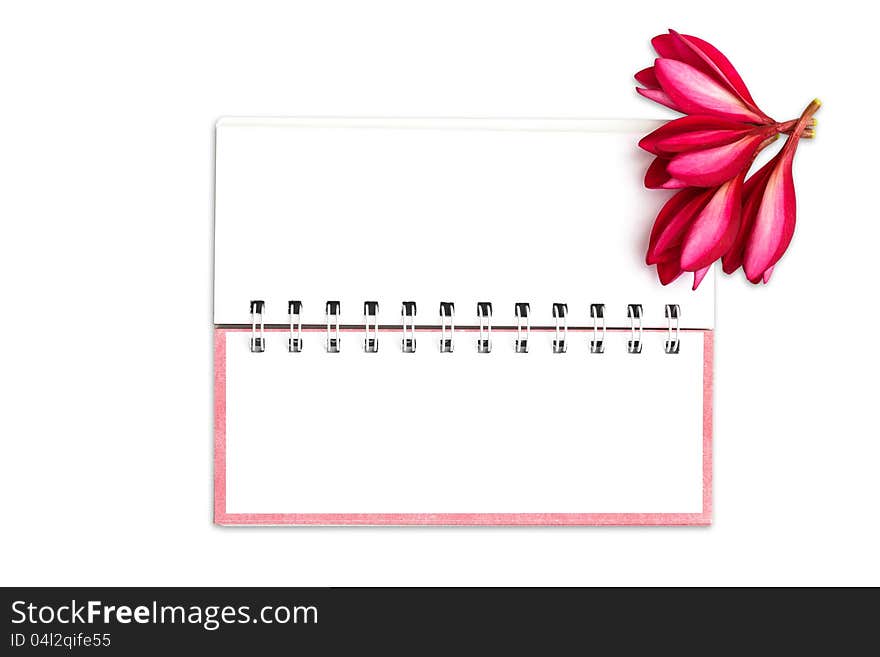 Note book paper with pink frangipani flower, Isolated on white with clipping path