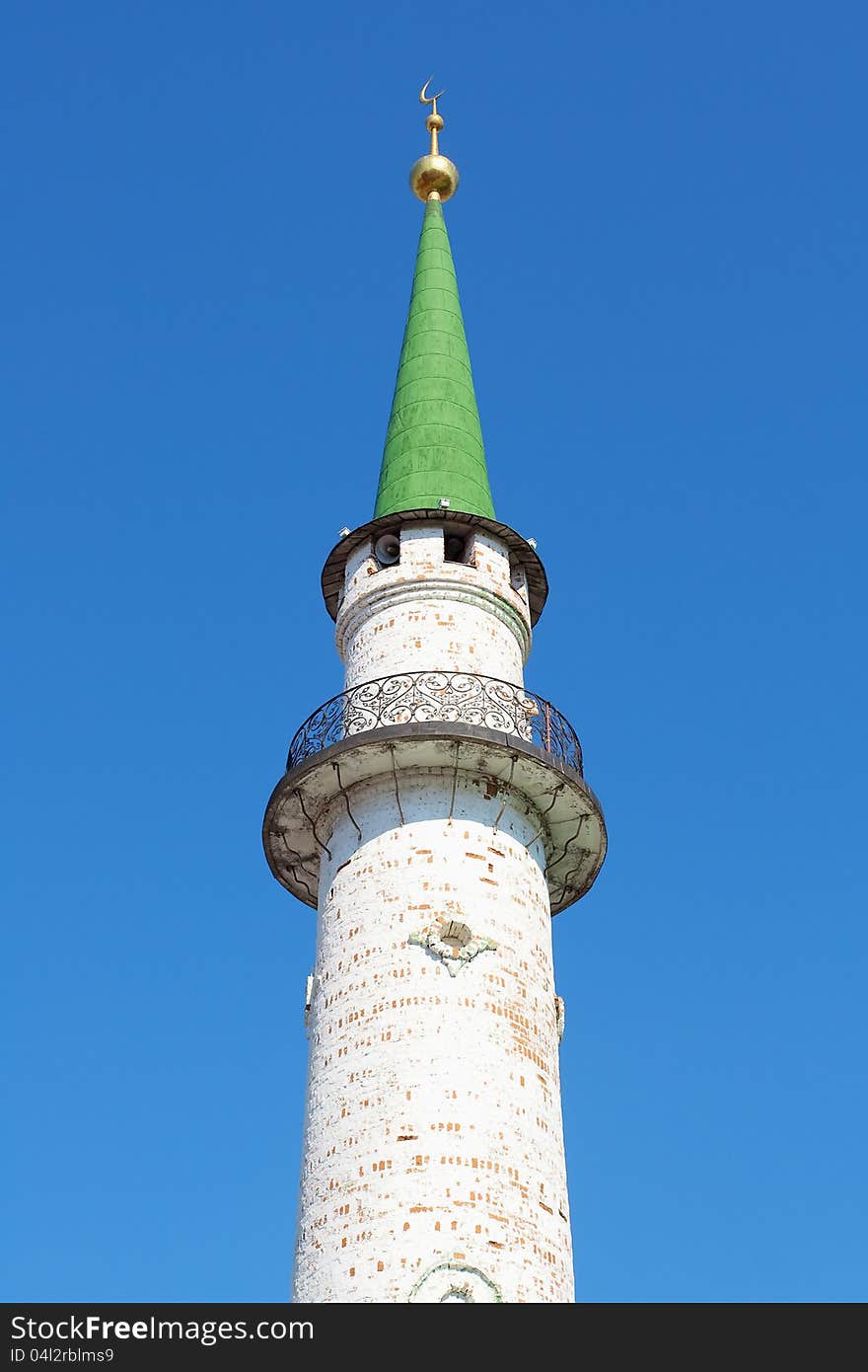 Minaret Muslim mosque towering against the blue sky