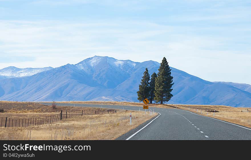 Highway road to Tekapo lake Tekapo town Southern Alps mountain valleys New Zealand