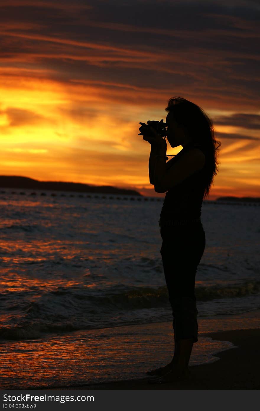 Woman photograph in sunset. Woman photograph in sunset