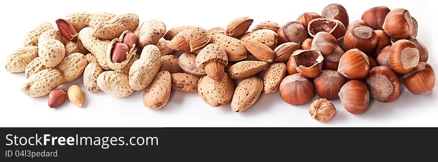 Group mixed nuts. Macro shot on white background.