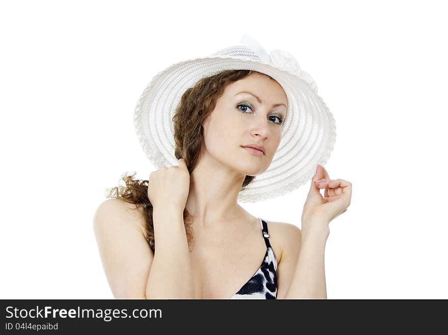 Portrait of a beautiful girl in the hat isolated