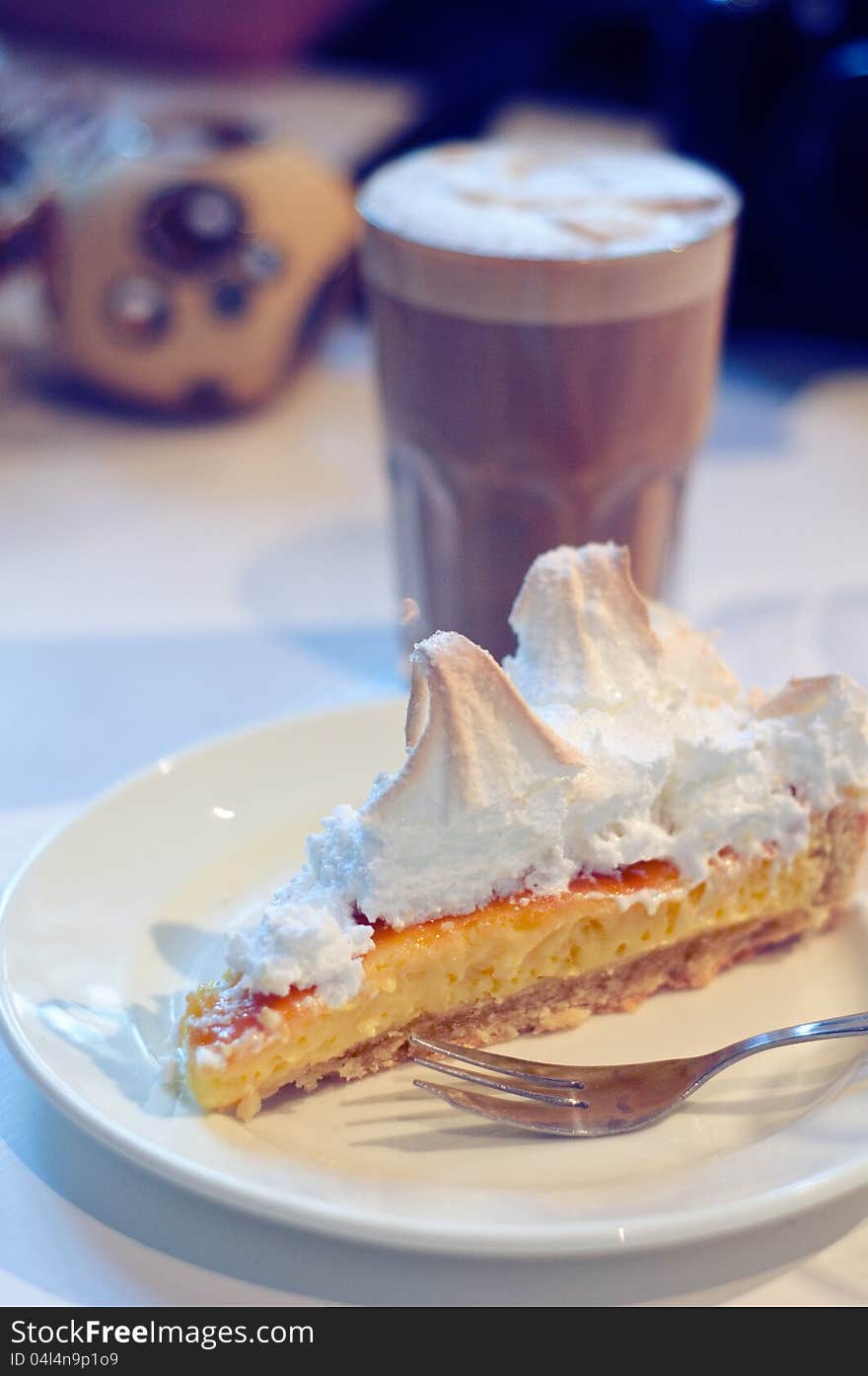 A slice of lemon curd and meringue tart