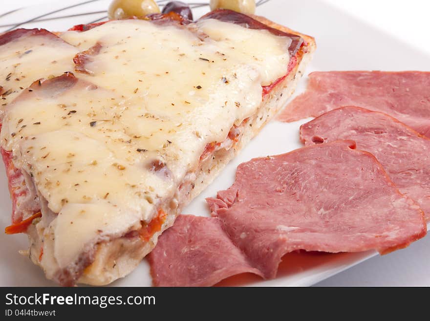 Pizza slice on a plate Closeup