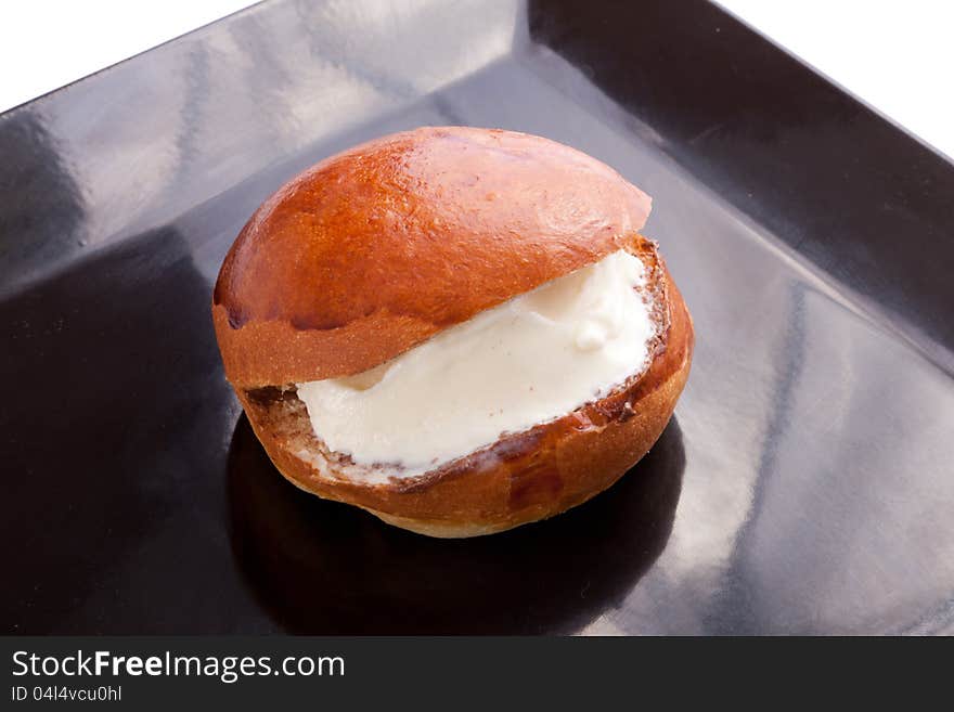 Tow Ice Cream Sandwich On black dish vanilla in bread