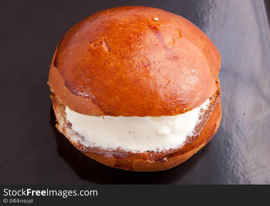 Tow Ice Cream Sandwich On black dish vanilla in bread