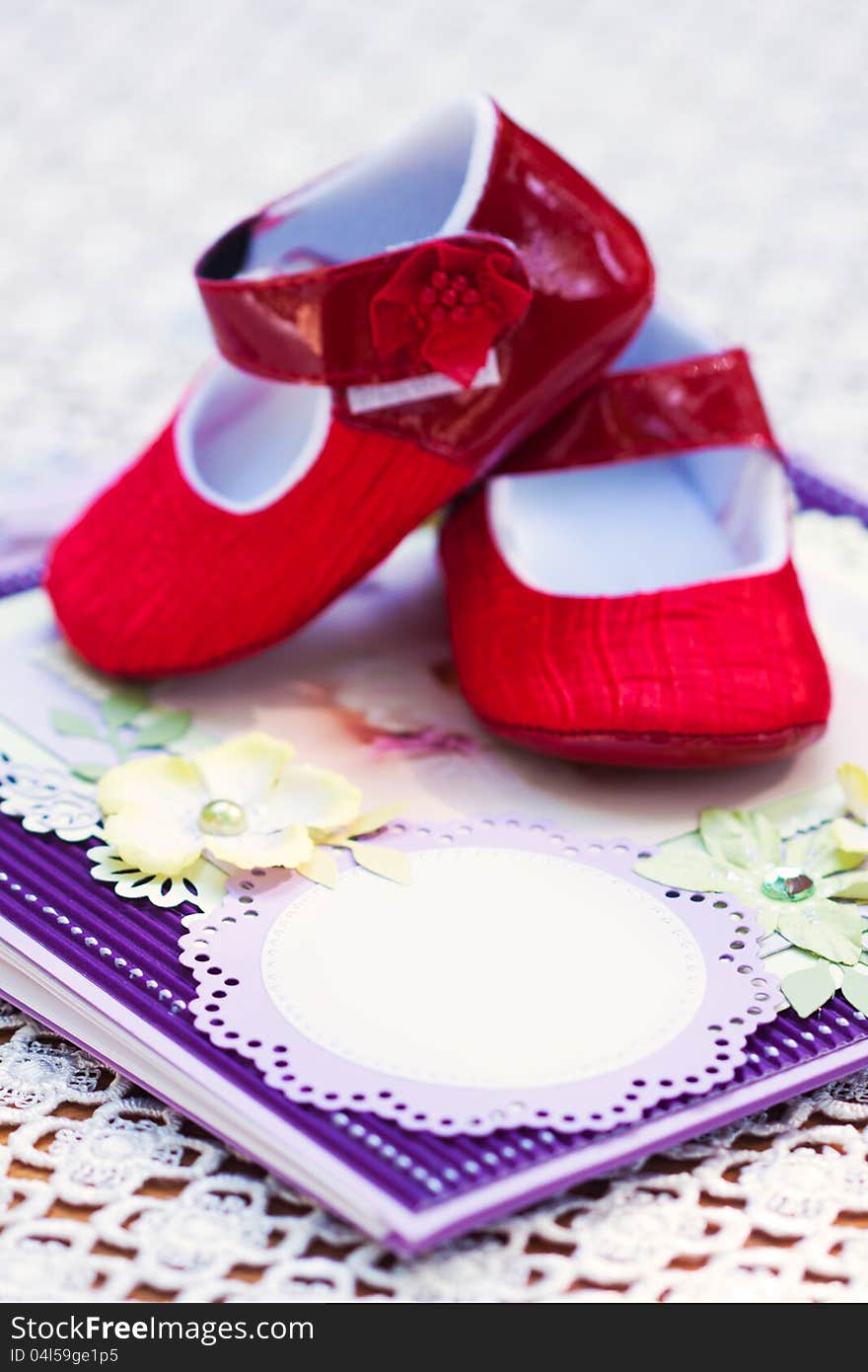 A notebook and pair of shoes or a little girl. A notebook and pair of shoes or a little girl