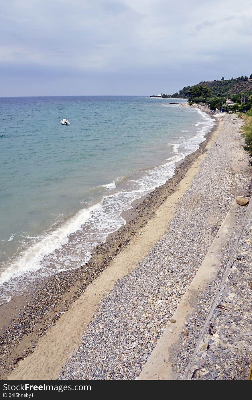 Golf beach with boats in Sithonia peninsula of Halkidiki in Greece. Golf beach with boats in Sithonia peninsula of Halkidiki in Greece