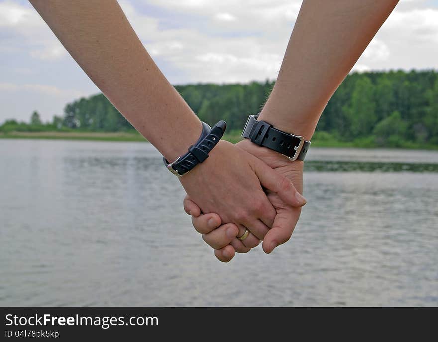 Two hands with watch together