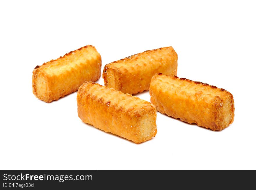 Four flaky cookies on a white background