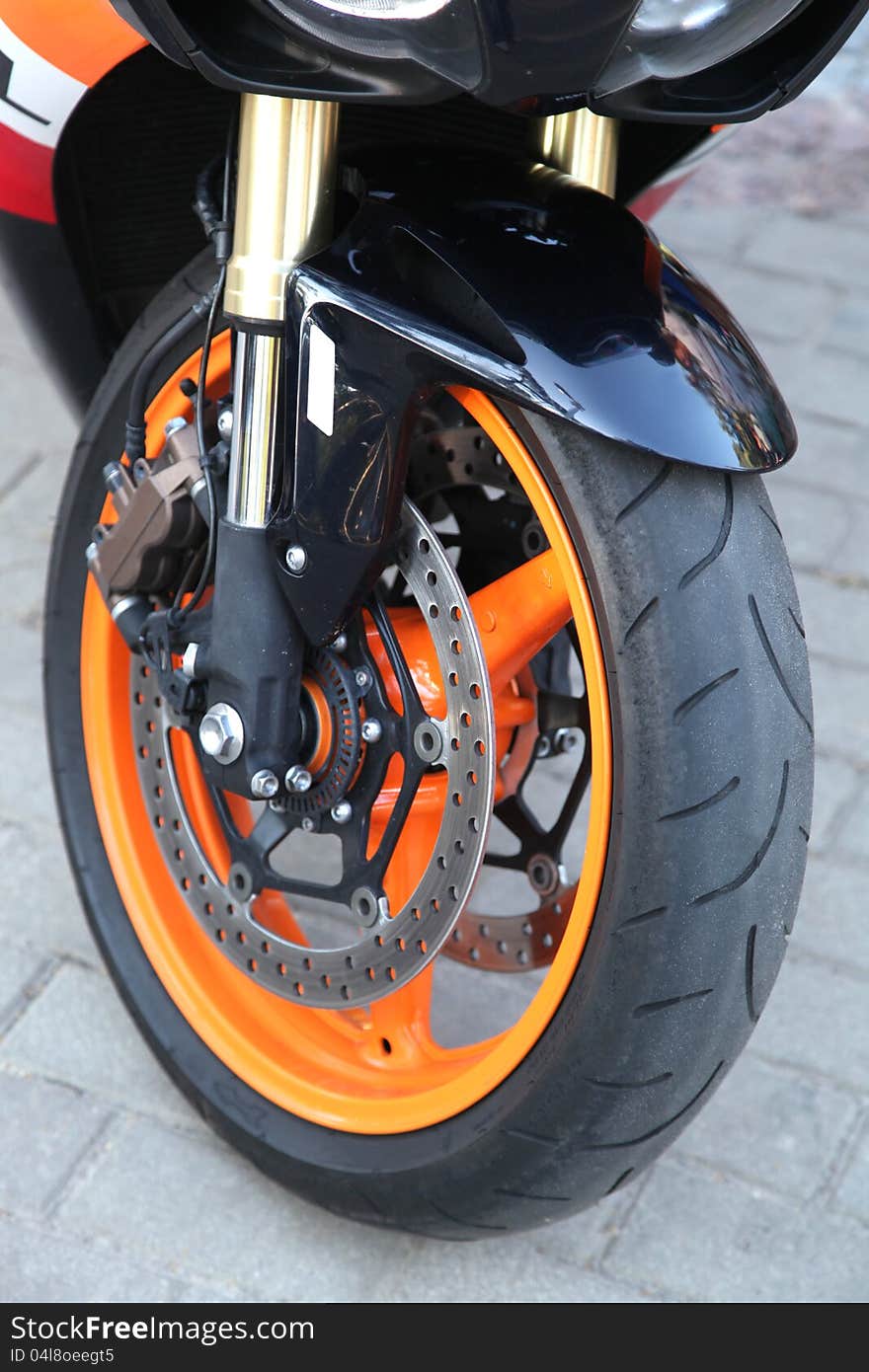 On a photo orange wheel sport bike