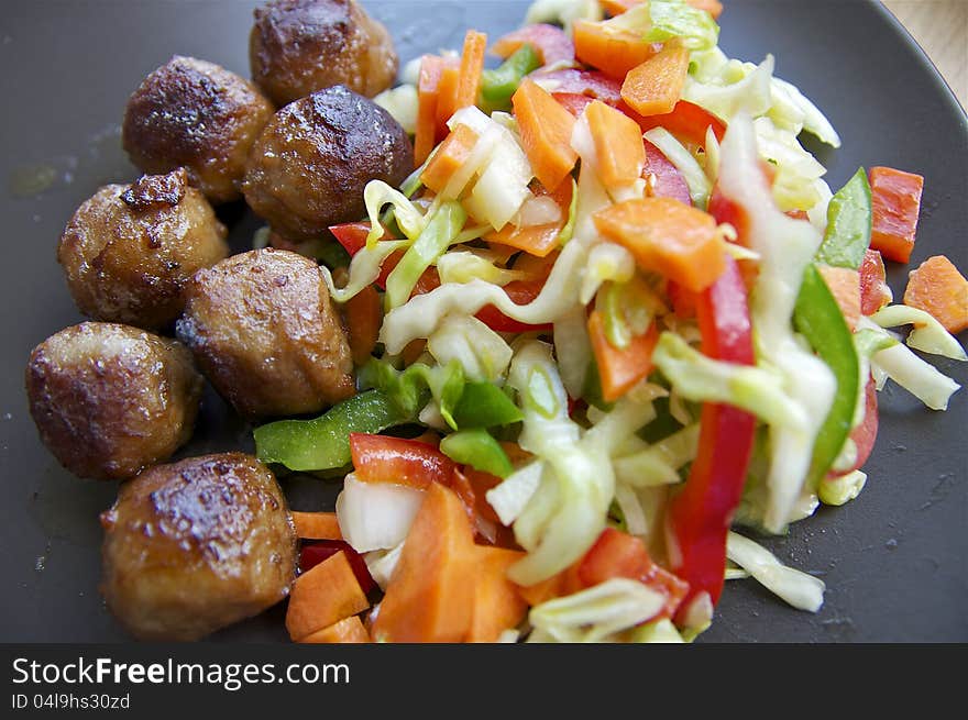 Salad and meatballs