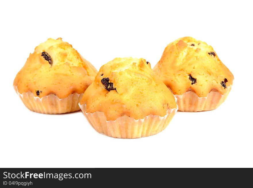 Three raisin muffins isolated on a white background