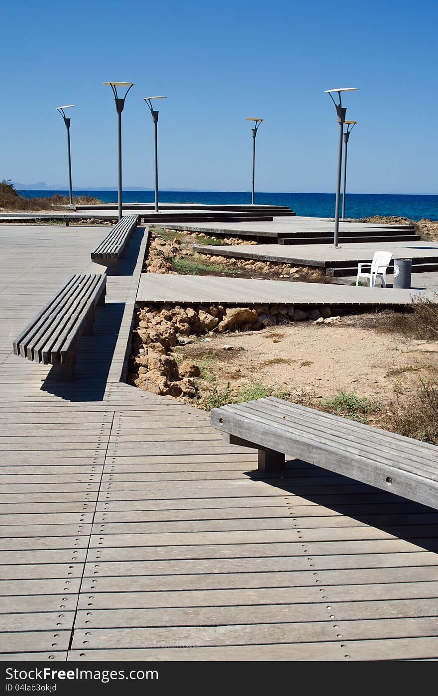 Road to the sea and lampposts