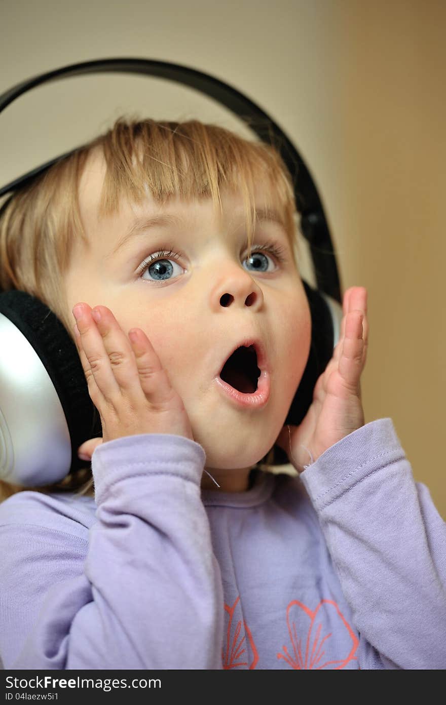 Little girl listening to music