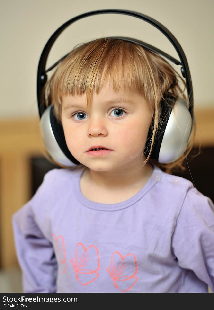 Little girl with headphones