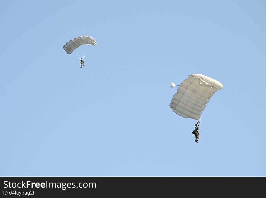 Two parachute jumpers demonstrating at an Air Show