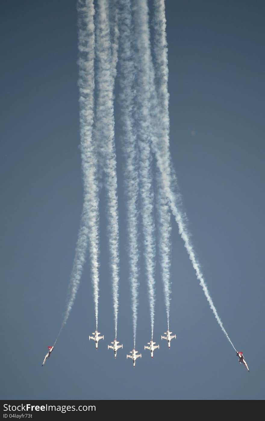 A plane formation demonstrating their acrobatics at an Air Show. A plane formation demonstrating their acrobatics at an Air Show