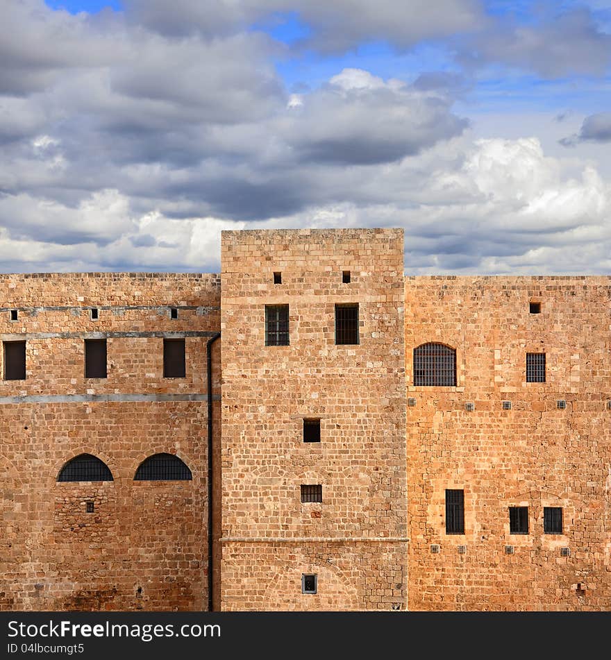 Old Middle East prison against expressive cloudy sky. Old Middle East prison against expressive cloudy sky