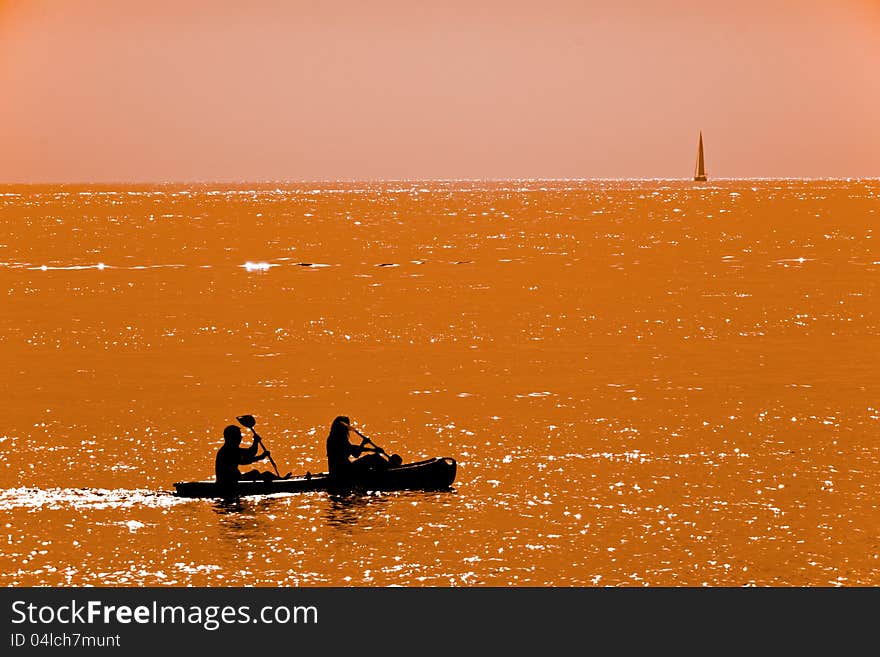 Couple Kayaking At Dusk