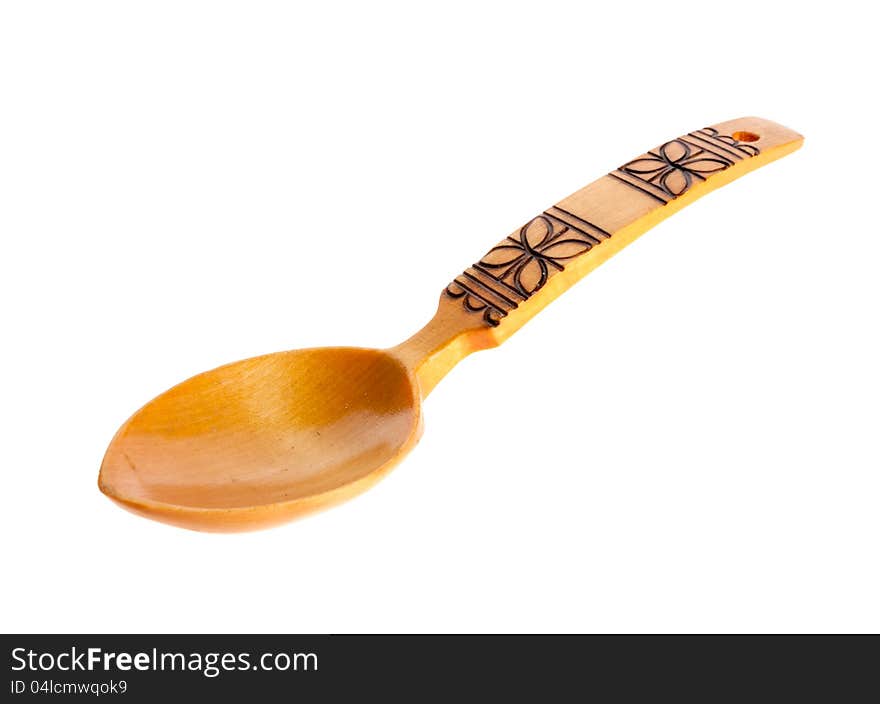 Wooden spoon on the white