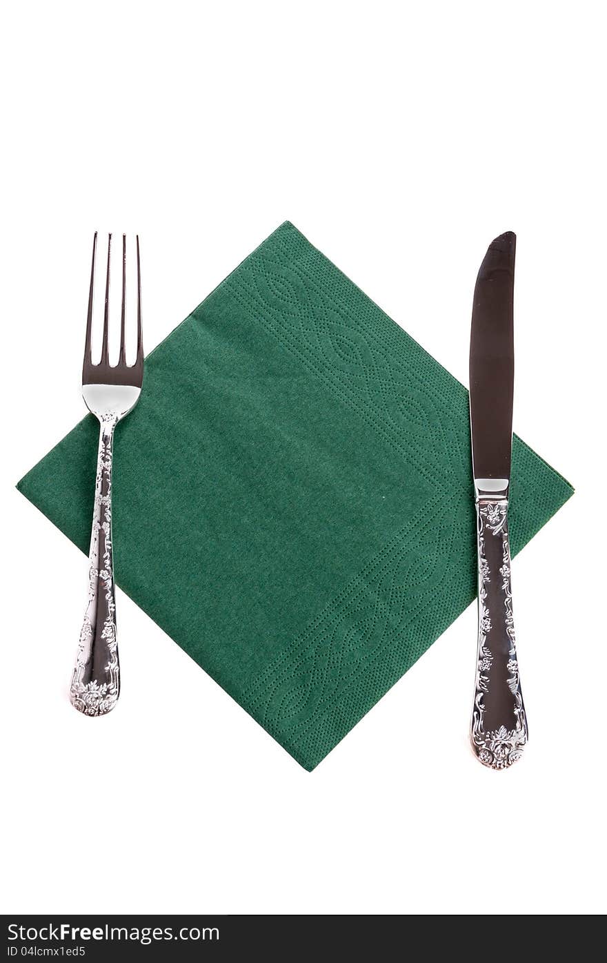 Fork and a knife lying on napkin