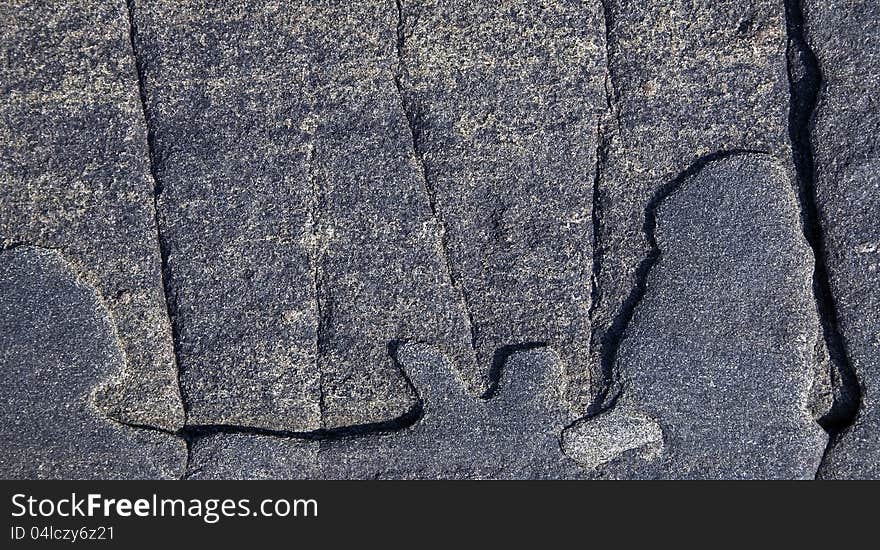 Shapes and cracks on granite stone in rural scene. Shapes and cracks on granite stone in rural scene