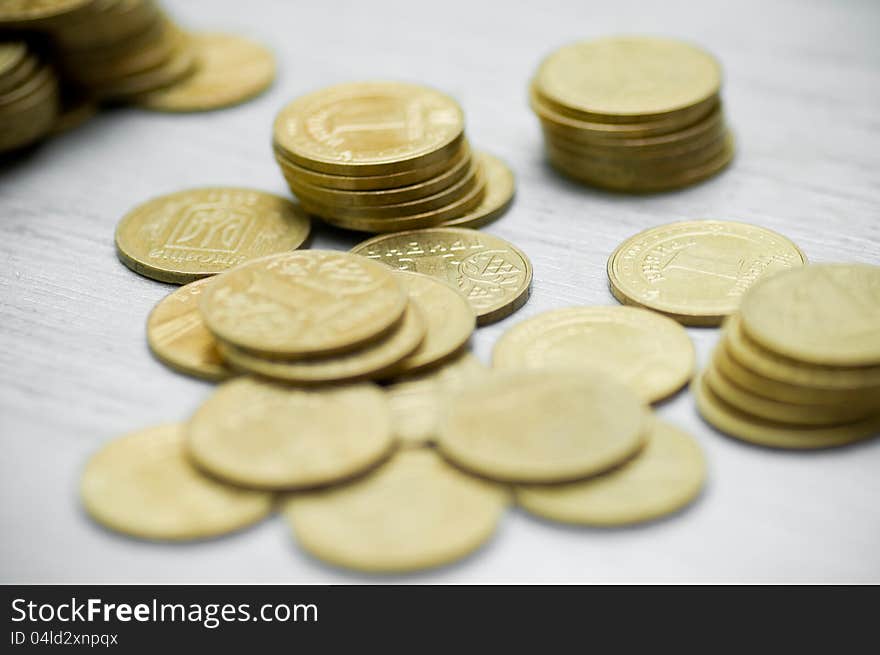 On a white background the scattered coins. On a white background the scattered coins