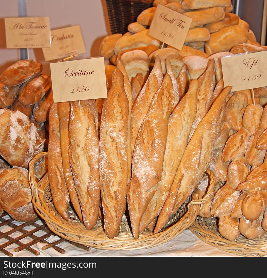 A Display of Various Fresh Bread Loaves for Sale. A Display of Various Fresh Bread Loaves for Sale.