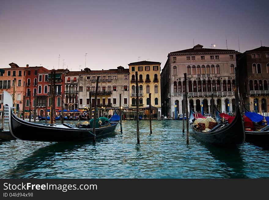 Famous gondolas of Venice moored in the grand canal in front of venican architecture. (79). Famous gondolas of Venice moored in the grand canal in front of venican architecture. (79)