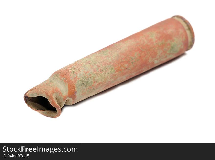 An old rusty rifle cartridge used during World War II on a white background. An old rusty rifle cartridge used during World War II on a white background