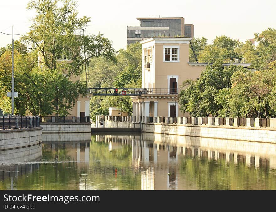 Urban landscape in the morning: gateway on the river. Urban landscape in the morning: gateway on the river