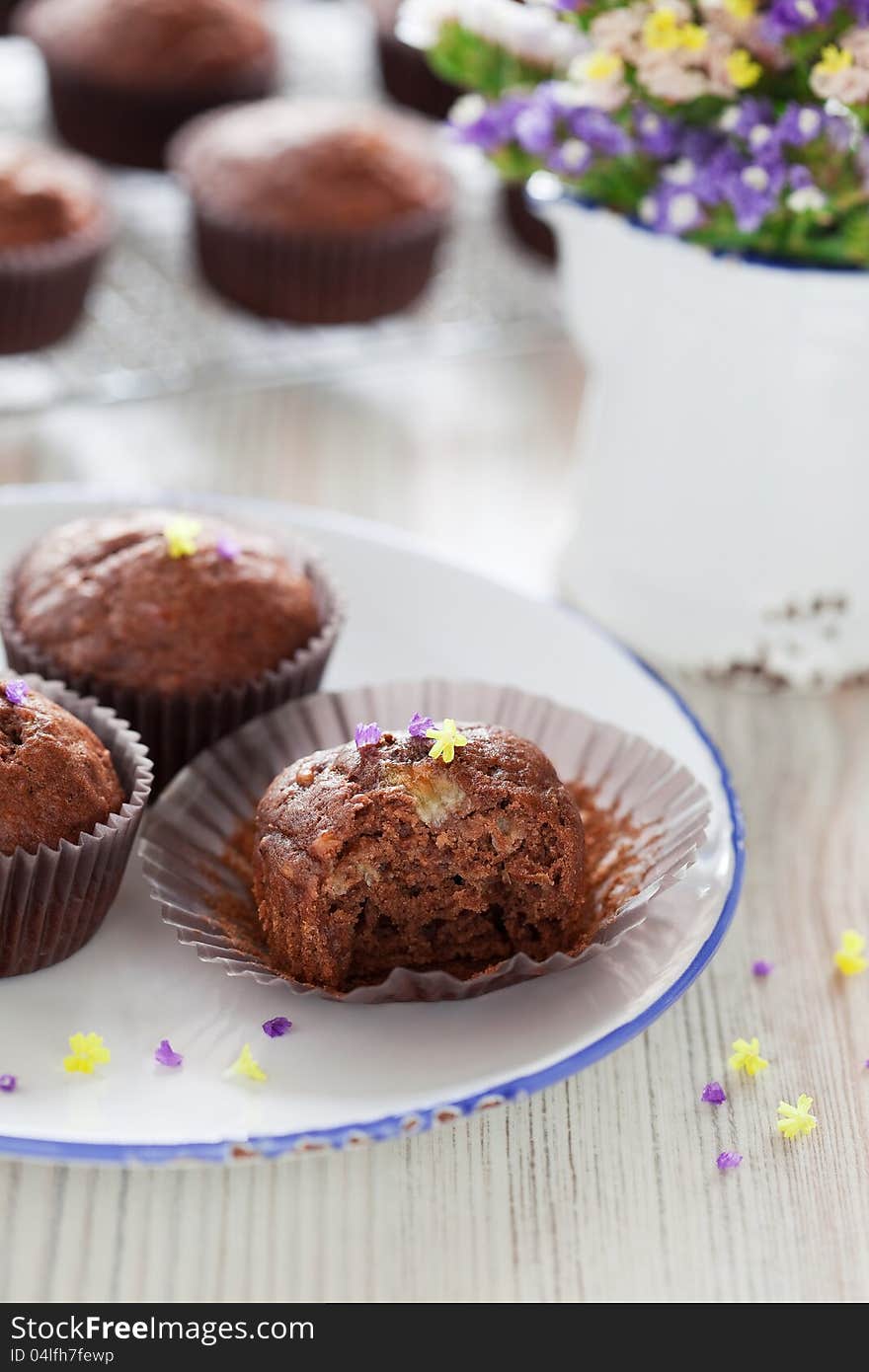 Bitten off chocolate banana muffins, selective focus