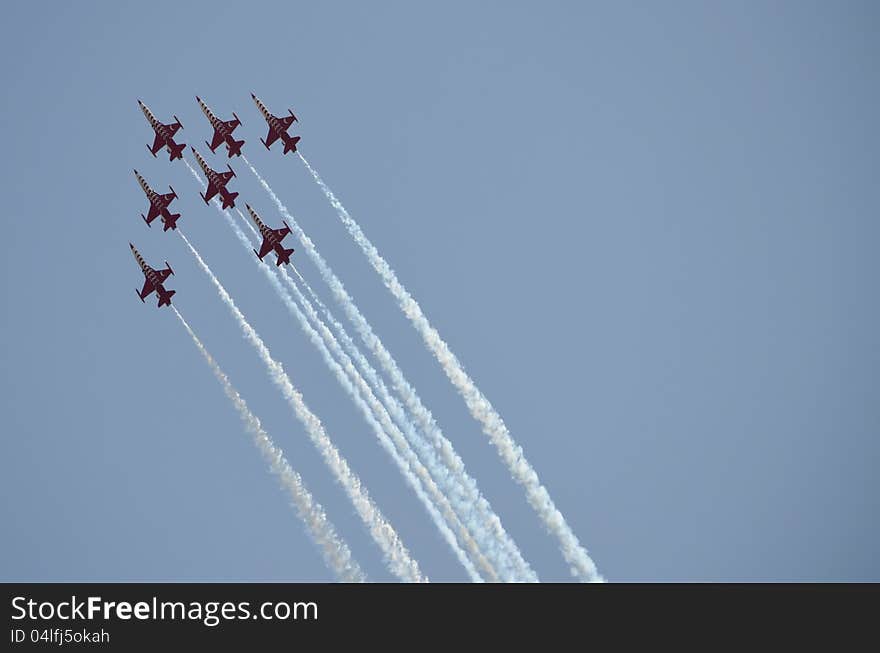 Aircrafts demonstrating acrobatics on an Air Show