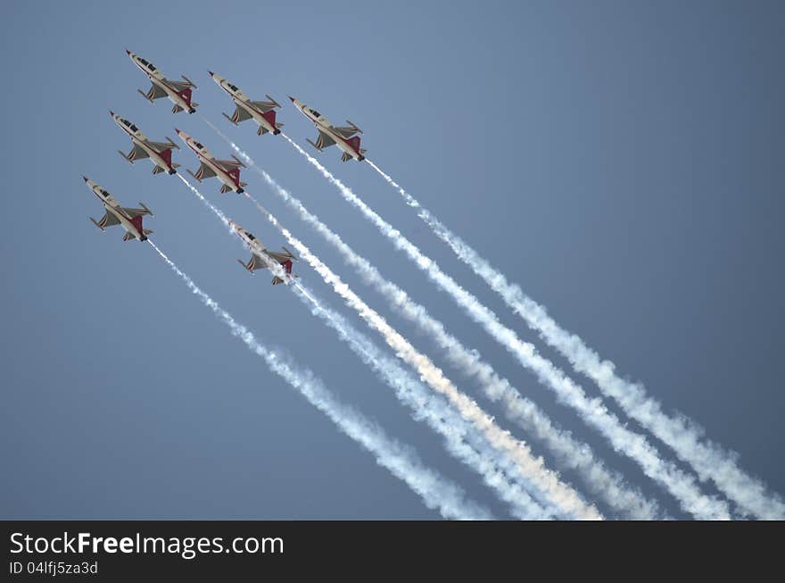 Aircrafts demonstrating acrobatics on an Air Show