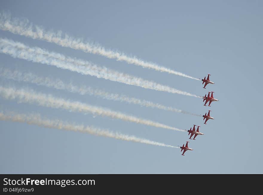 Aircrafts demonstrating acrobatics on an Air Show