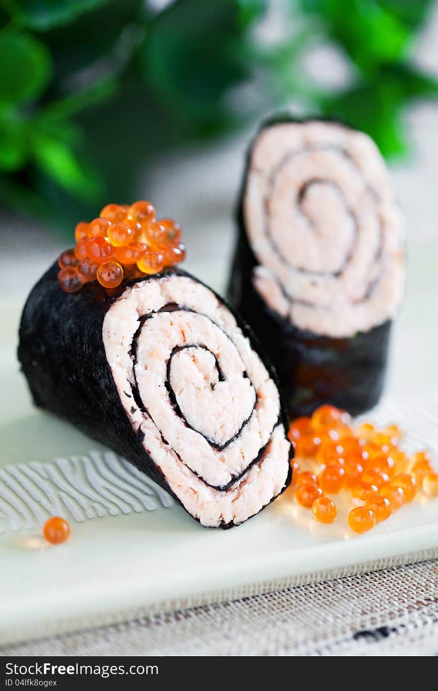 Salmon and nori roll, selective focus. Salmon and nori roll, selective focus