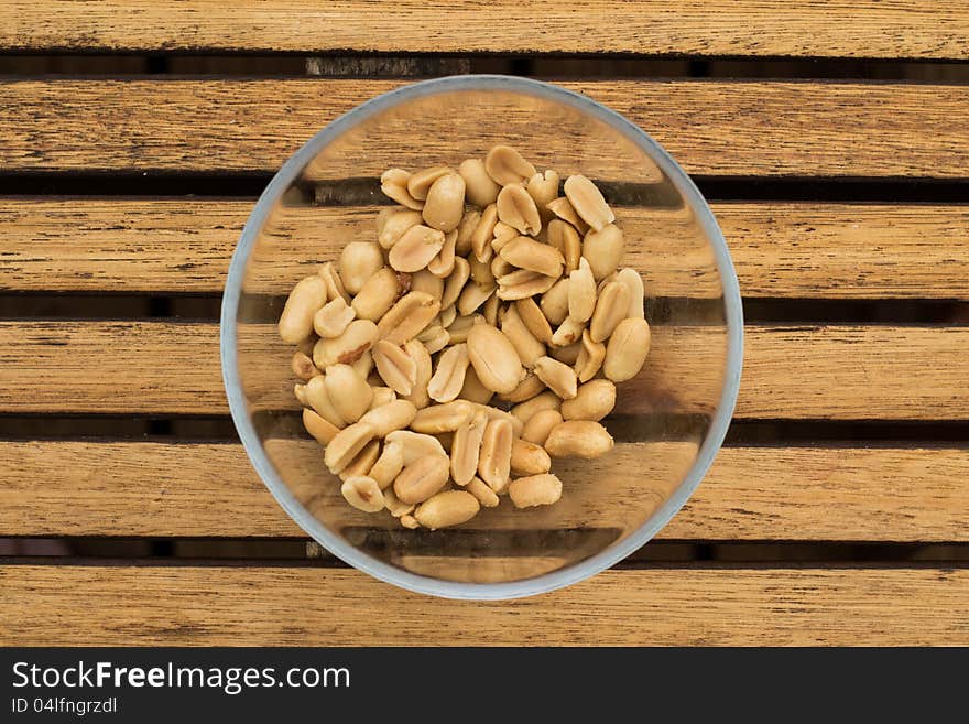 Peanuts in a boul on a table